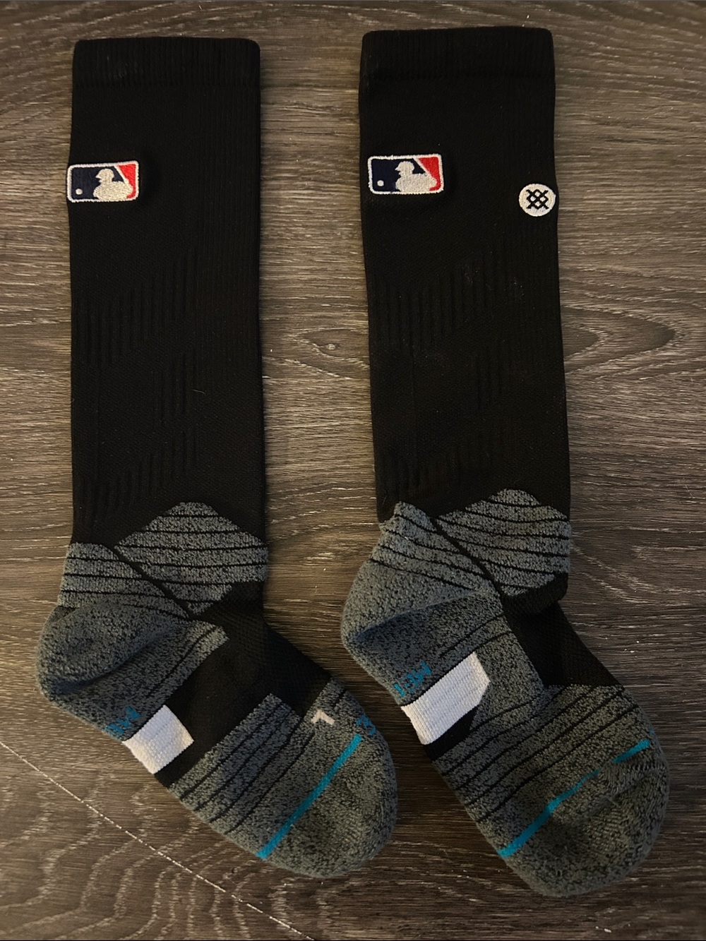 Stance Black Crew Socks with Gray Cushioned Soles and Small Red/Blue Logo